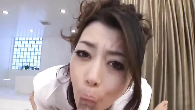 Hot Japanese woman caresses cock with her lips